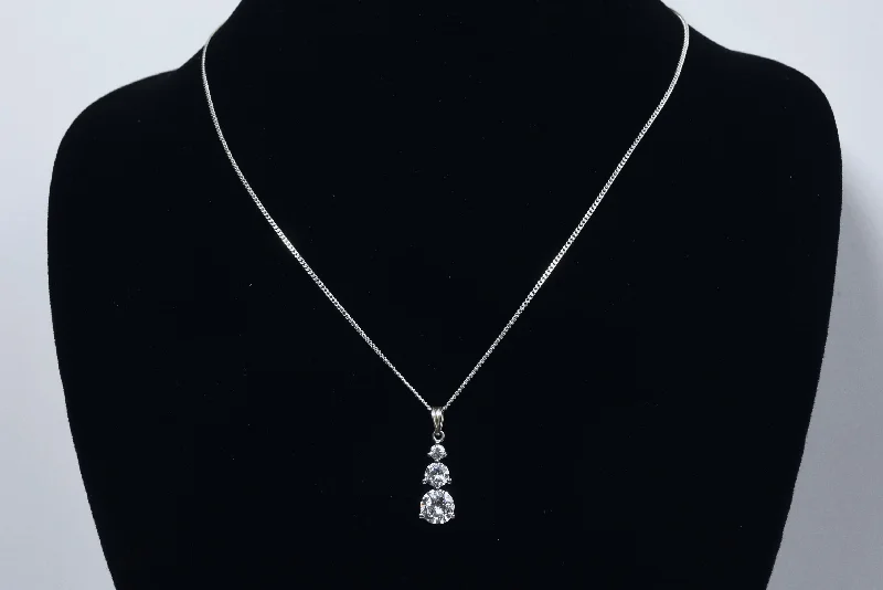 Classic Silver Necklace For Minimalist Look-Avon - Sterling Silver Graduated Cubic Zirconia Drop Pendant on Sterling Silver Chain Necklace - 16"