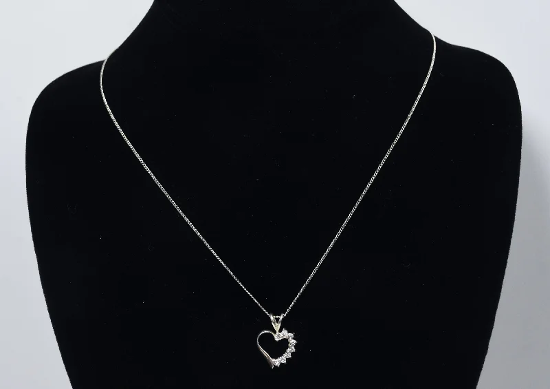 Elegant Heart-Shaped Necklace For Romantic Occasions-Avon - Sterling Silver and Topaz Heart Pendant on Sterling Silver Chain Necklace - 18"